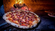 My Spicy Honey Pepperoni  pizza coming out of the oven at A.W. Wander in Manlius, our 33rd stop on the CNY Pizza Tour. (Charlie Miller | cmiller@syracuse.com)