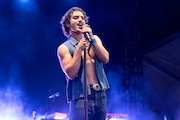 CHICAGO, ILLINOIS - AUGUST 01: Benson Boone performs during 2024 Lollapalooza Festival at Grant Park on August 01, 2024 in Chicago, Illinois.