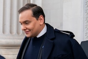 FILE - Rep. George Santos, R-N.Y., leaves the Capitol after being expelled from the House of Representatives, Friday, Dec. 1, 2023, in Washington.   (AP Photo/Stephanie Scarbrough)