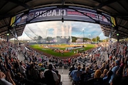 The New York Yankees line the third baseline and the Detroit Tigers line the first baseline, as the 20 Little League teams participating in the Little League World Series line the infield during the National Anthem before the Little League Classic baseball game at Bowman Field in Williamsport, Pa., Sunday, Aug. 18, 2024. (AP Photo/Gene J. Puskar)