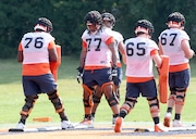 Syracuse offensive linemen line up for a drill on the first day of fall camp. Dennis Nett | dnett@syracuse.co