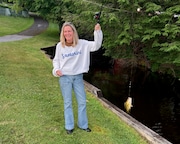 Karen BenYehuda, of Westvale, won her family's annual fishing contest on Fourth Lake with this 2.5-inch rock bass caught on a 3-inch nightcrawler.