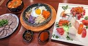 Lunch at Ocean Sushi on Erie Boulevard: (left to right) sauce beef, soft tofu seafood stew, beef bibimbap and a sampler of sushi. Ocean  opened last week. (Charlie Miller | cmiller@syracuse.com)