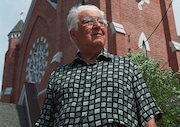 Nicholas Masterpole, of Syracuse, stands  in front of St. Patrick's Church. He was presented with the church's Irish Heritage Award during their Irish Festival in 2002.