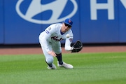 New York Mets outfielder Brandon Nimmo makes a diving catch during the seventh inning of a baseball game against the Miami Marlins at Citi Field, Sunday, Aug. 18, 2024, in New York. (AP Photo/Seth Wenig)