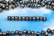 The word face inheritance on the sky background