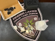 Three people were arrested after over a pound of cocaine and two guns were found in Auburn on Thursday, Aug 15, 2024.