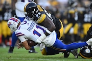 Pittsburgh Steelers defensive tackle Keeanu Benton (95) and Nick Herbig (51) sack Buffalo Bills quarterback Mitchell Trubisky (11) during the first half of an NFL exhibition football game, Saturday, Aug. 17, 2024, in Pittsburgh. (AP Photo/David Dermer)