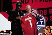 Ohio State wide receiver Marvin Harrison Jr. poses with NFL commissioner Roger Goodell after being chosen by the Arizona Cardinals with the fourth overall pick during the first round of the NFL football draft, Thursday, April 25, 2024, in Detroit.