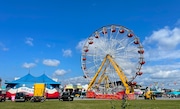 A Ferris wheel towers over the Midway at the New York State Fair. Wednesday, Aug. 24, 2022. (Katrina Tulloch | ktulloch@syracuse.com)