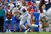 Buffalo Bills wide receiver Curtis Samuel (1) runs with the ball during the first half of a preseason NFL football game against the Chicago Bears in Orchard Park, N.Y., Saturday, Aug. 10, 2024. (AP Photo/Adrian Kraus)