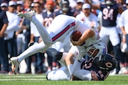 ORCHARD PARK, NEW YORK - AUGUST 10: Khalid Kareem #52 of the Chicago Bears sacks Shane Buechele #6 of the Buffalo Bills during the second half of a preseason game at Highmark Stadium on August 10, 2024 in Orchard Park, New York. The Bears won 33-6. (Photo by Rich Barnes/Getty Images)