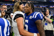 Indianapolis Colts quarterback Anthony Richardson (5) and Jacksonville Jaguars quarterback Trevor Lawrence (16) meet on the field after an NFL football game, Sunday, Sept. 10, 2023, in Indianapolis.