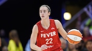 Indiana Fever's Caitlin Clark works against the Dallas Wings in a WNBA basketball game, Wednesday, July 17, 2024, in Arlington, Texas. (AP Photo/Tony Gutierrez)