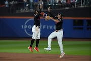 New York Mets' Francisco Lindor, left, and Tyrone Taylor, right, celebrate after winning a baseball game against the Miami Marlins, Friday, Aug. 16, 2024, in New York. (AP Photo/Pamela Smith)