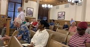 Ben Lockwood, president and CEO of Housing Visions (standing at microphone), speaks at a public hearing Tuesday, July 30, on Syracuse's new housing strategy.